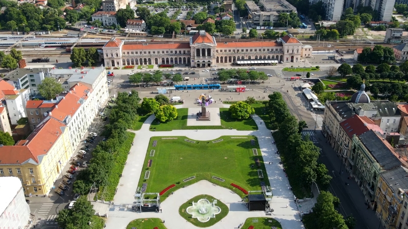 Aerial view of Zagreb’s main square with gardens, statue, and historic buildings